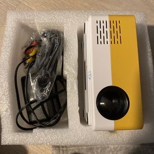 YELLOW BRAND NEW MINI PROJECTOR